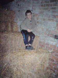 My son Josh in our hay barn